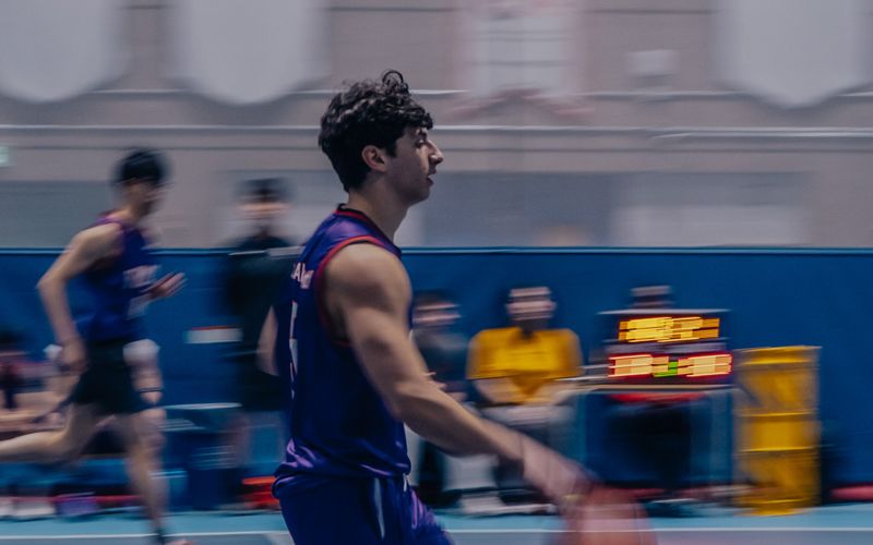 Me dribbling up the court in a purple jersey