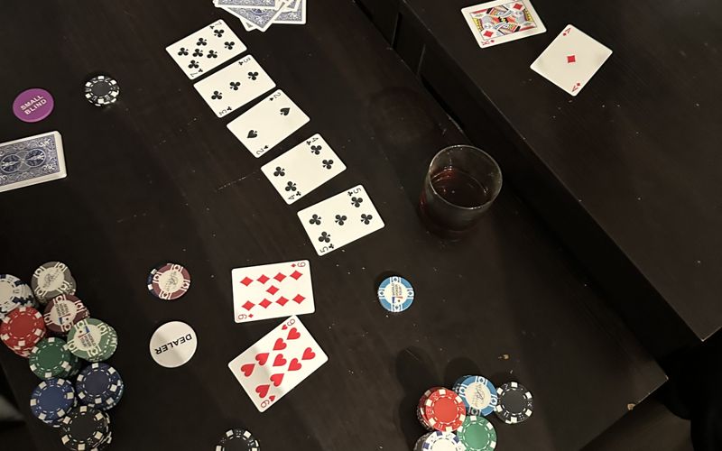 Poker table with the board and a pair of nines