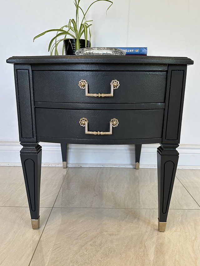 Close-up of the restored drawers and brass pulls